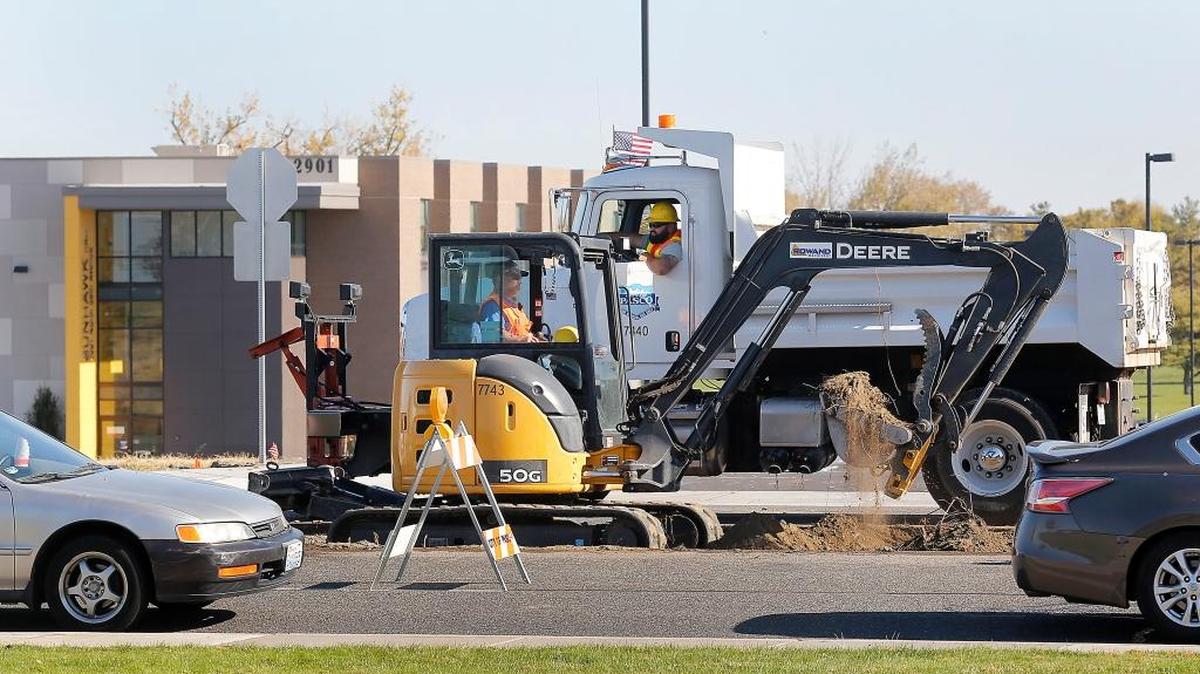 Crews from the City of Pasco remove dirt and concrete from a section of the center landscaping traffic island Tuesday on 20th Avenue south of West Argent Road near the new Columbia Basin College student housing complex. The work is part of a project to install a turn lane into the new student facility. Drivers can expect temporary lane closures, traffic delays and congestion during the work forecast to last through Nov. 16.