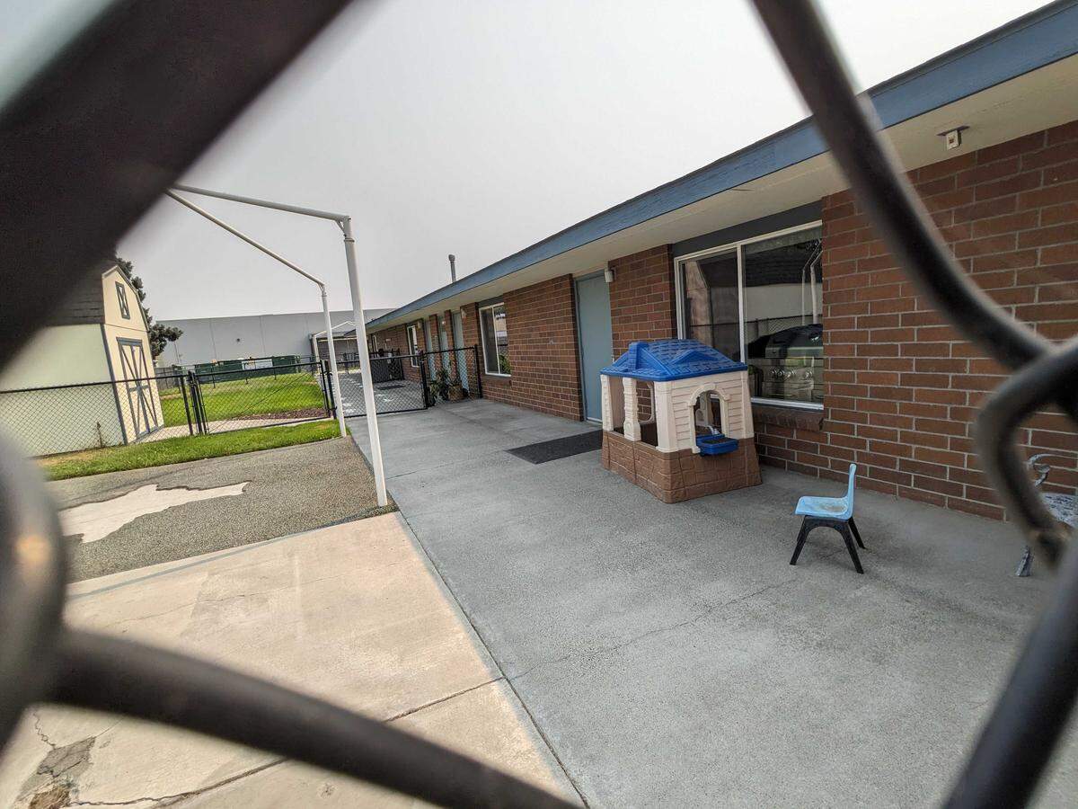 The fenced-off yard at 16 North Huntington Street, former site of the Kennewick Inspire Development Centers.