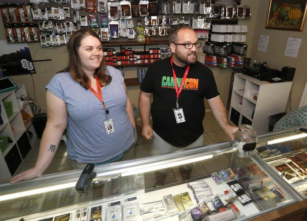 Jessy and Steve Lee stand in July 2016 in the sales area of their marijuana dispensary, called Green2Go, in Finley.