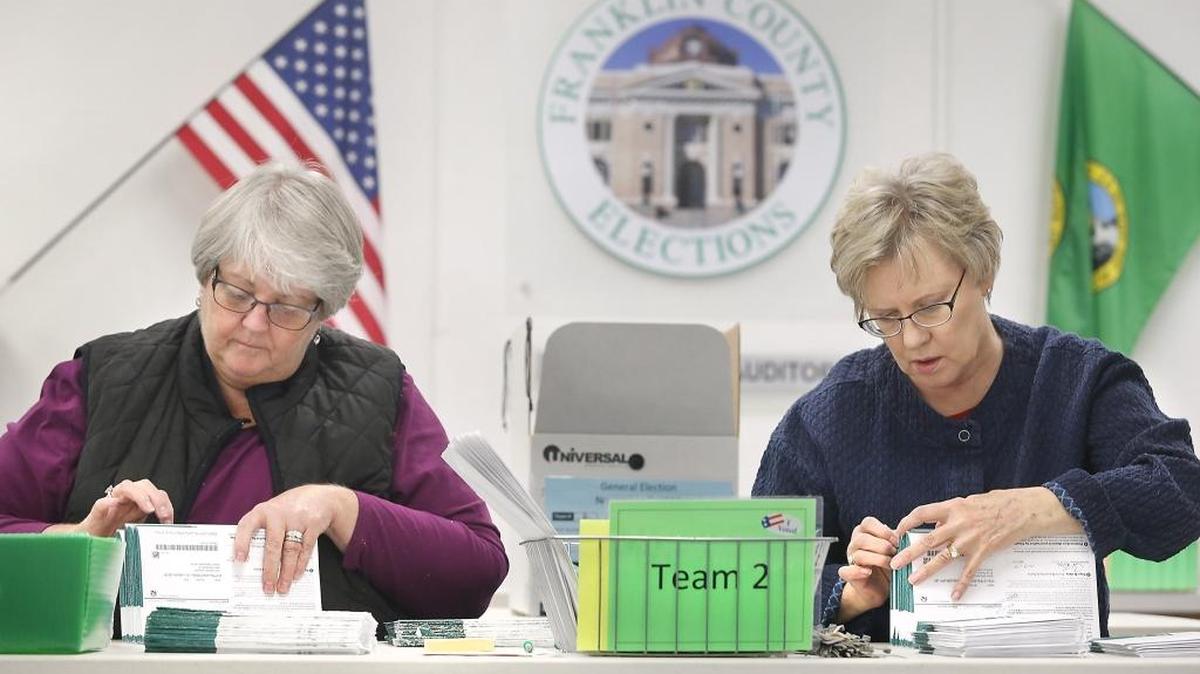 Susan Van Doren, left, and Norene Erlandson, both Franklin County election board workers, process ballots Tuesday for the general election at the Franklin County Elections Center in Pasco. Numerous city, school district and county races and issues were being decided by voters. Check tricityherald.com for full results.