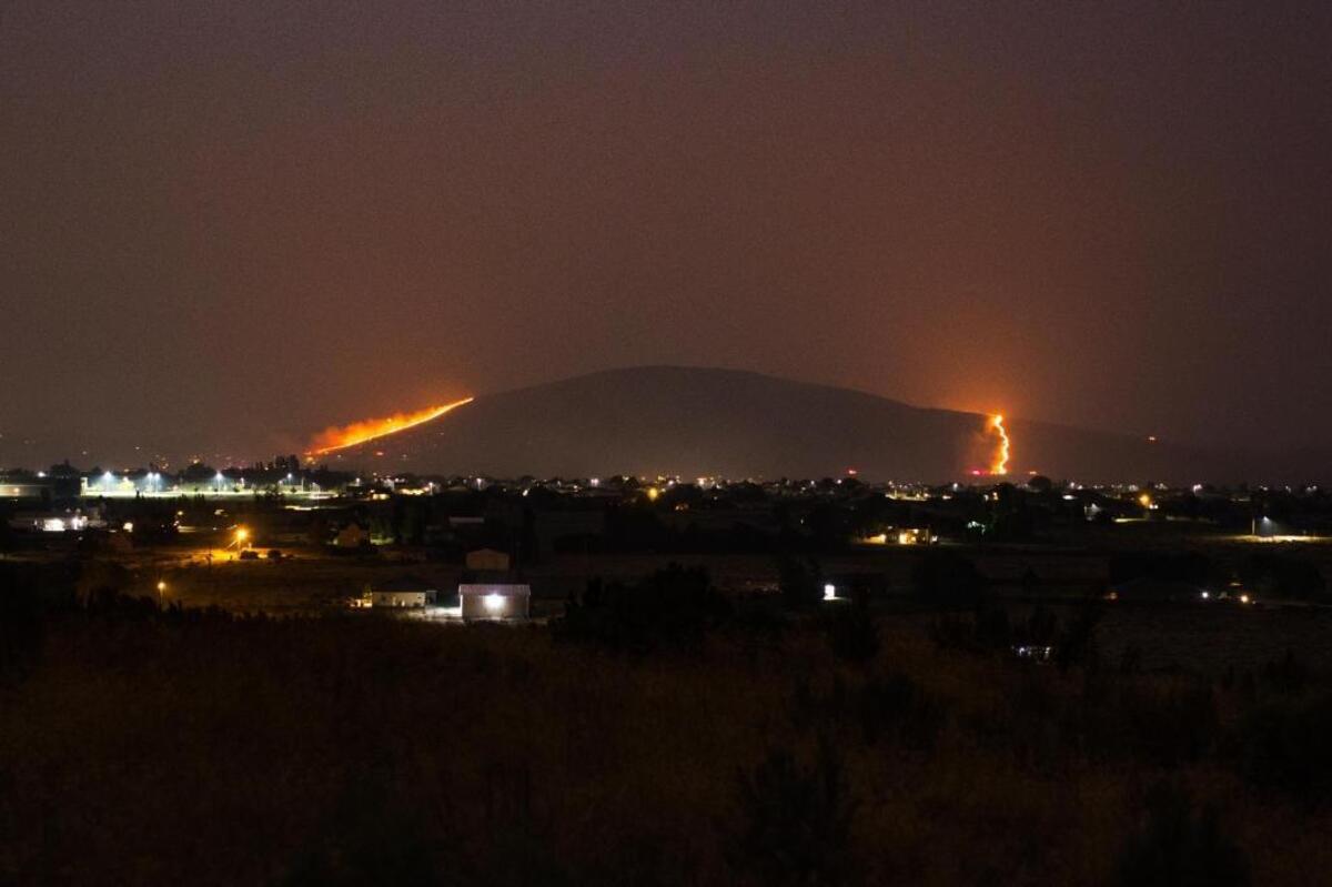 Jason Tomlinson of Richland took this photo from Flat Top Park in West Richland, showing two fire lines on Candy Mountain.