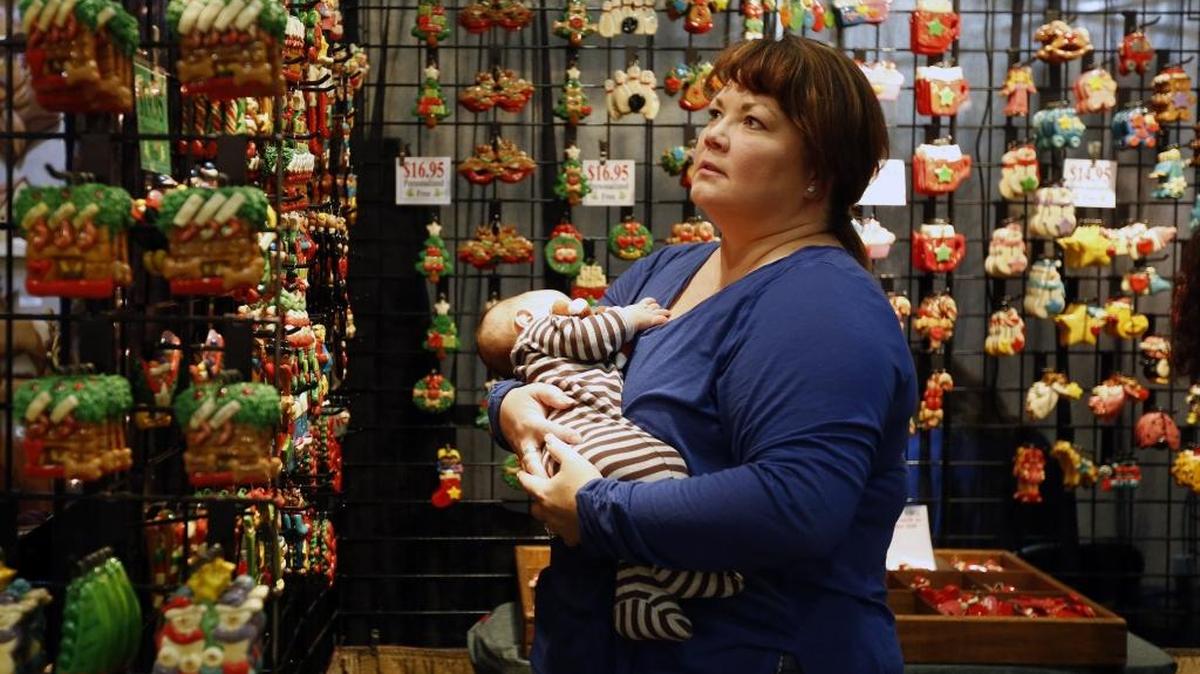 Carrie Meyer of Richland holds her 4-month-old grandson William Kinner on Friday as she looks for Christmas ornaments from the ’Tis the Season vendor during the first day of Custer’s 39th annual Christmas Arts & Crafts Show at the TRAC facility in Pasco. Over 150 artisans are participating in the annual show which continues from 9 a.m. to 6 p.m. Nov. 7 and from 10 a.m. to 4 p.m. Nov. 8. Admission is $6 and free for kids under 12. Parking is free. Admission is good all weekend.