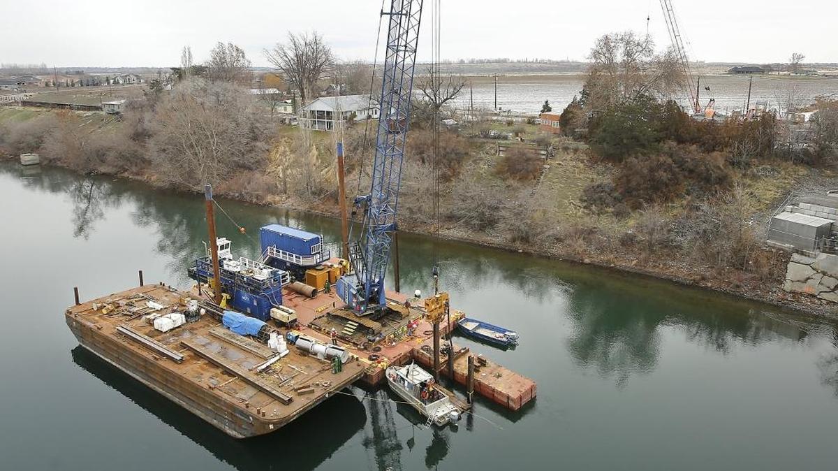 A work barge drives temporary steel pilings into the Columbia River on Thursday for a new water intake facility being built by Pasco upriver from the Interstate 182 bridges on Court Street. The work is part of a $7.5 million project for the West Pasco Water Treatment Plant and includes adding two huge pumps with a capacity of six million gallons a day.