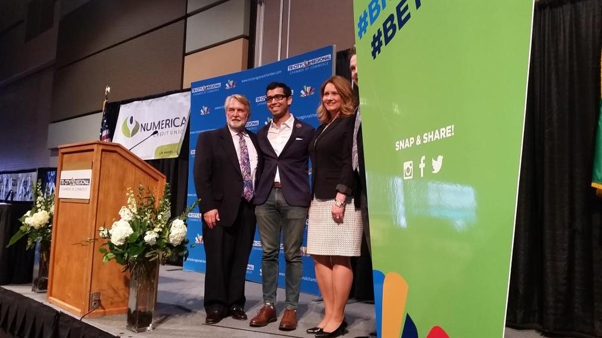 Alex Diaz of Uber, center, stands with Marty Conger, past chairman of the Tri-City Area Regional Chamber of Commerce, and Lori Mattson, president and CEO of the chamber, at the chamber’s annual lunch Wednesday in Kennewick.
