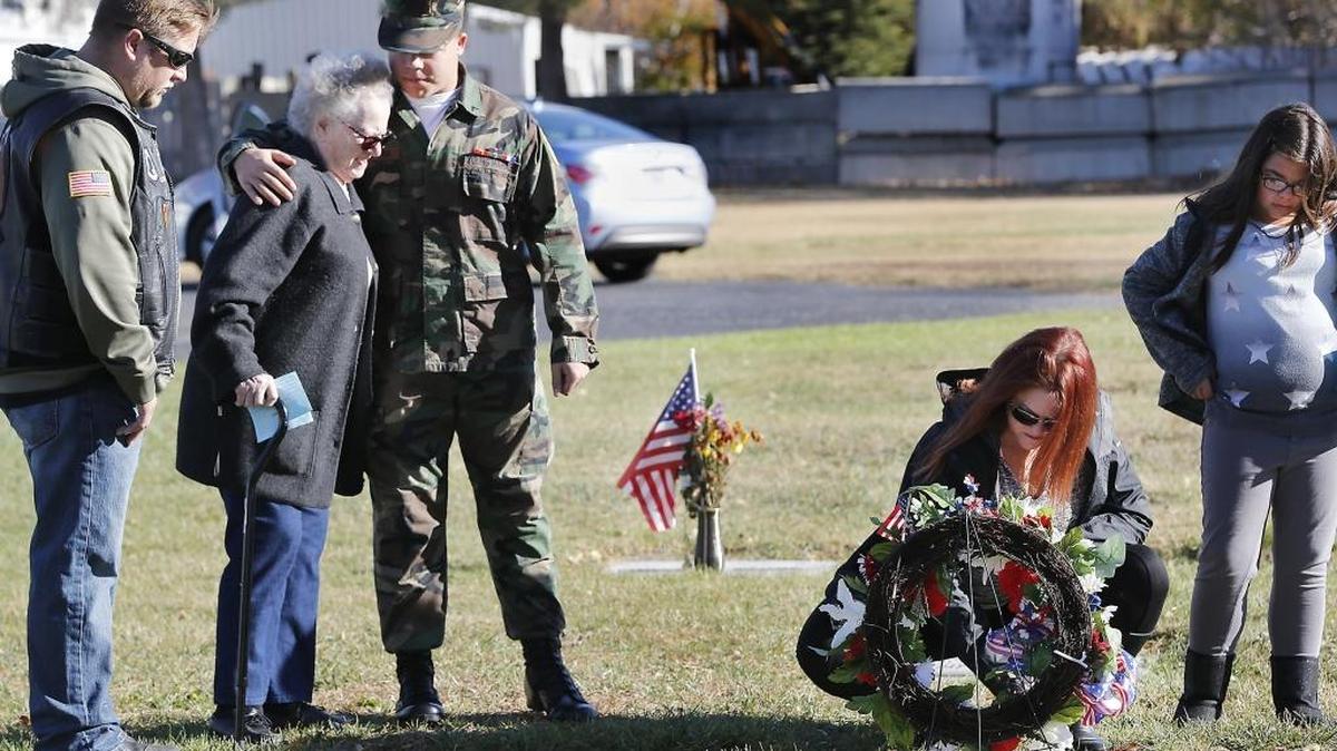 Young Marine Jayson Castorena, 15, hugs his great-grandmother Anna Berger during a visit to her husband’s grave following Wednesday’s Veterans Day program at Columbia Memorial Gardens in Pasco. Jayson’s father Jeff Madsen, mother Tamara Madsen and his sister Isabella Castorena, 11, from left, also visited the grave of World War II veteran Warner Berger. About 50 people attended the annual event held by the American Legion Post 34 in Pasco.