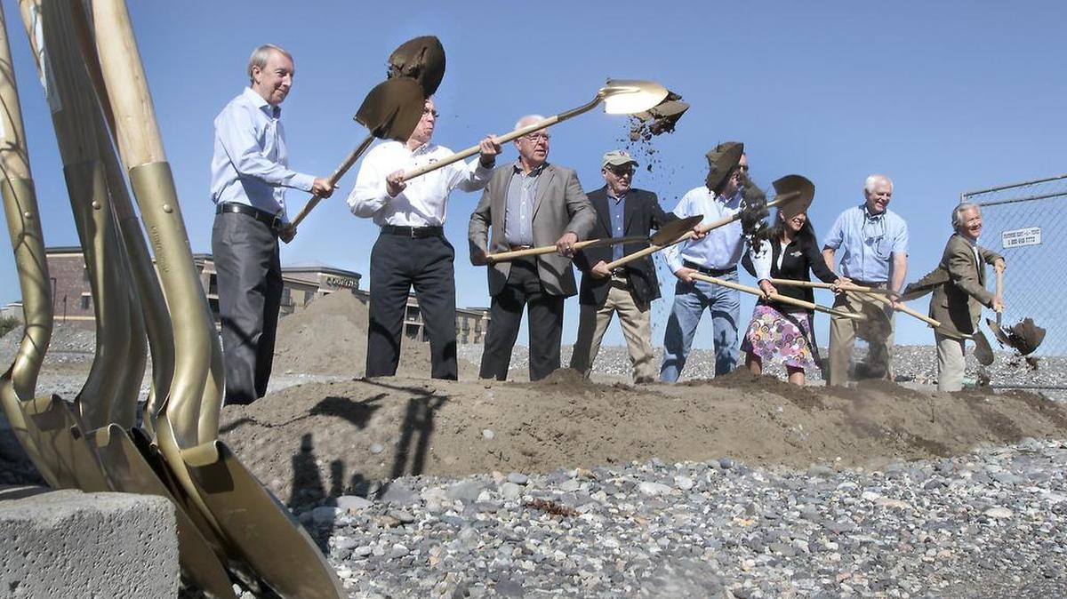 Tom Drumheller, far left, of Escape Lodging, is joined by local dignitaries for a ceremonial groundbreaking of The Lodge at Columbia Point in 2015. Drumheller, 64, died earlier this week after a short battle with cancer.