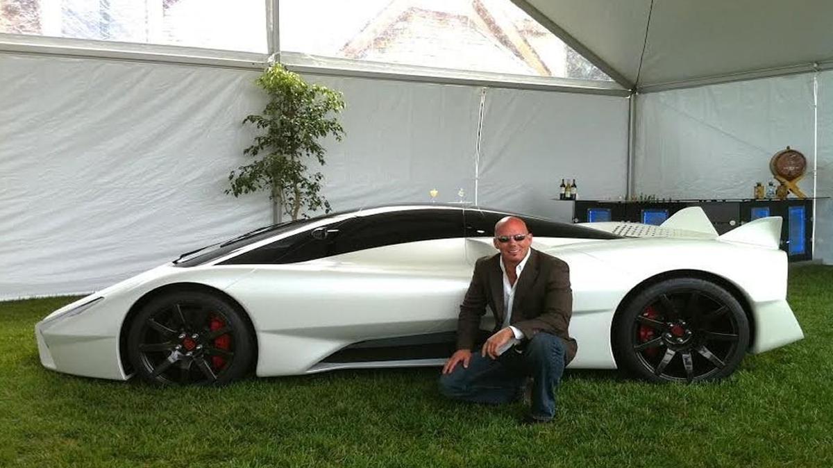SSC North American founder Jerod Shelby poses with his company’s Tuatara car at an unveiling event at Pebble Beach. He expects a West Richland facility should be finished in 2016 and start making cars the next year.