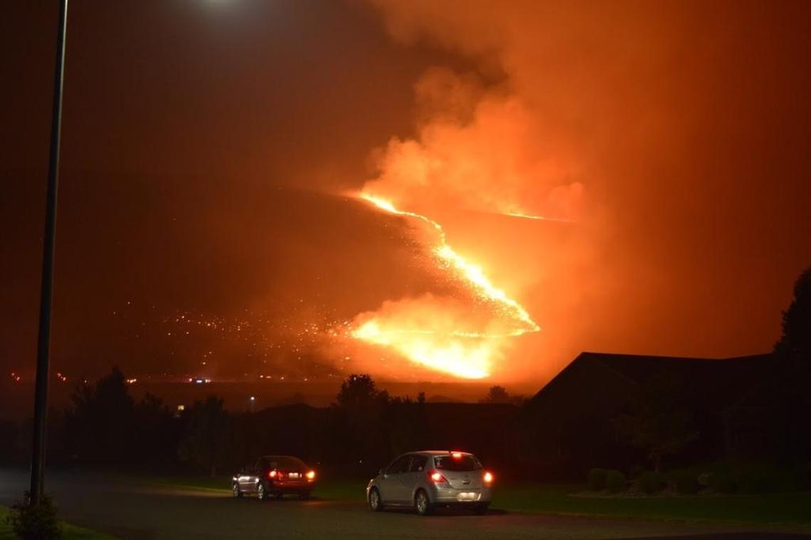 Flames spread across Candy Mountain early Friday morning in West Richland.