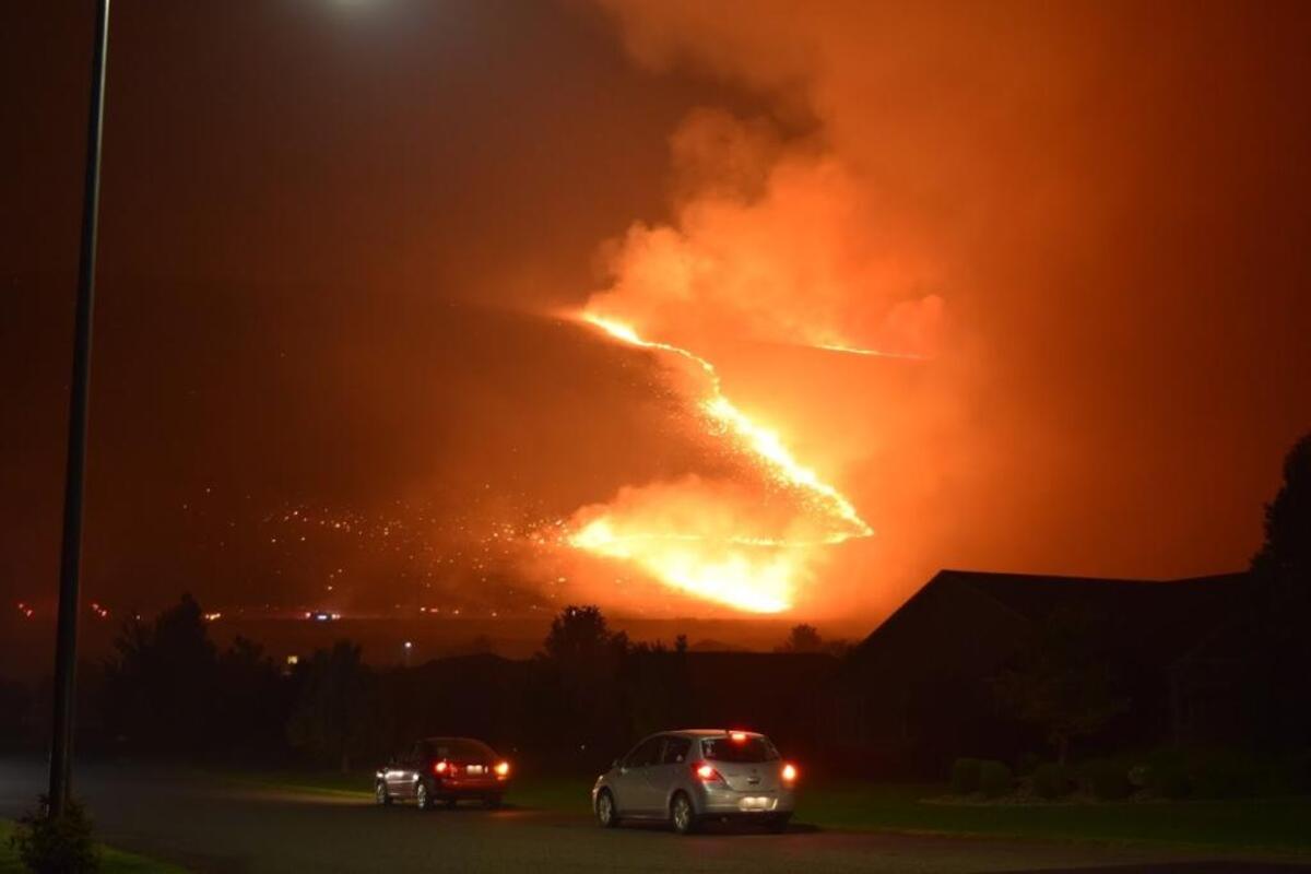 Flames spread across Candy Mountain early Friday morning in West Richland.