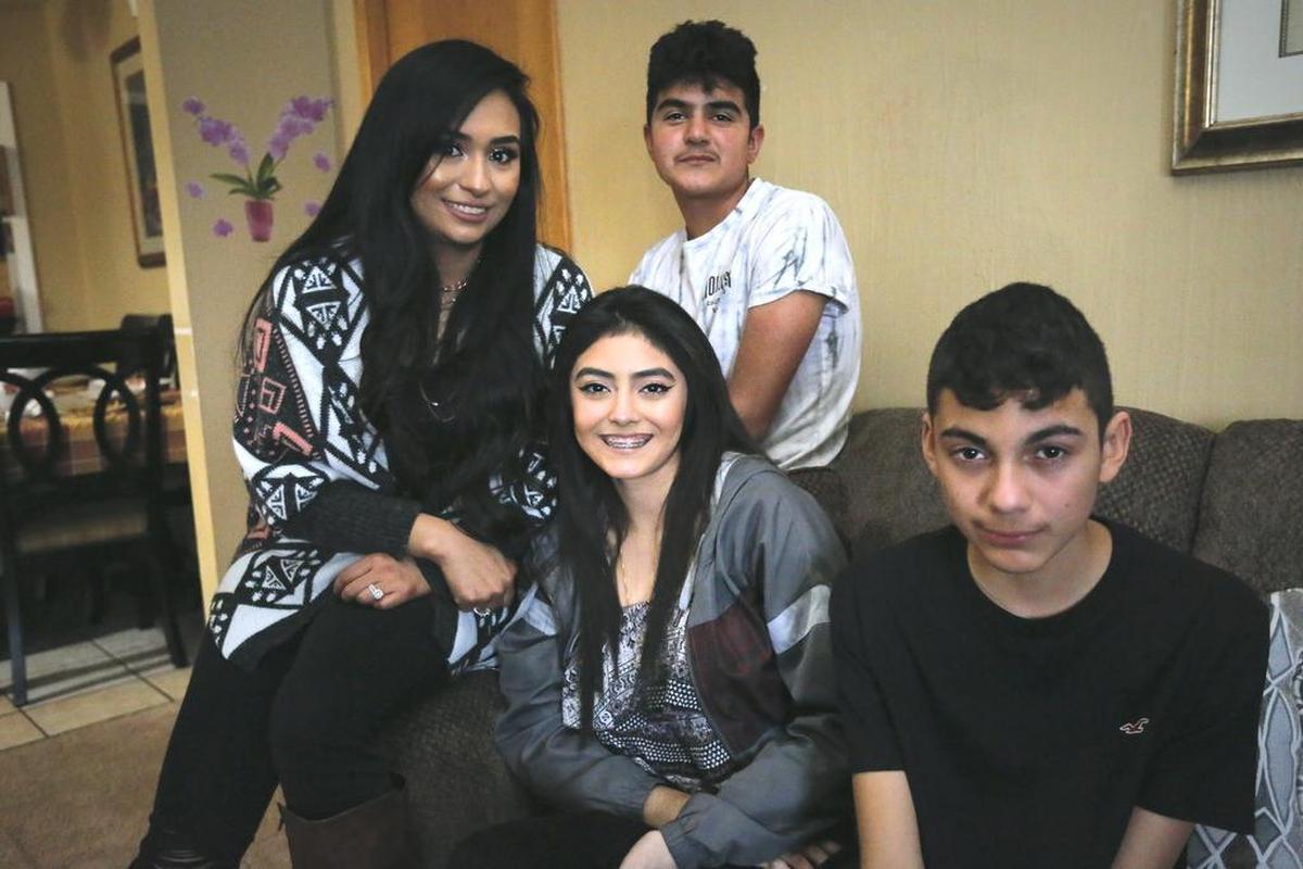 Siblings Karen Montes, left, Froilan Godines Jr., Princess Godines, center, and Aaron Godines talked last year about their memories of their father Froilan Godines who was killed at a Pasco bar where he worked as a bouncer.