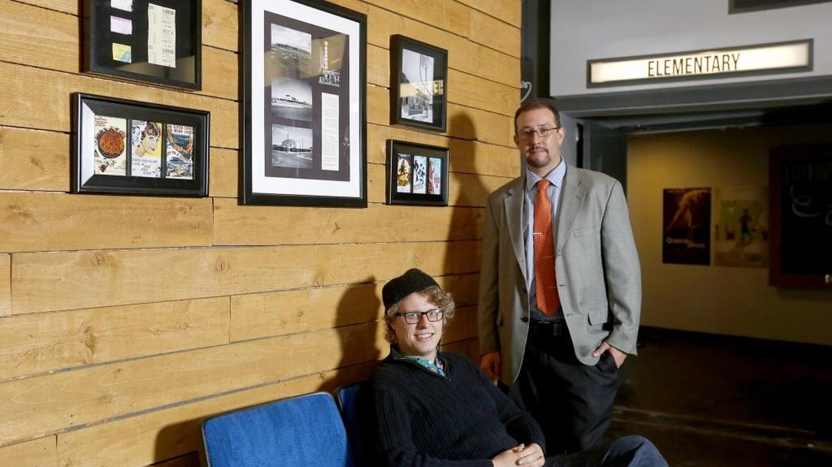 Local filmmaker Davin Diaz, right, and local painter Cameron Mills pose for a photo at the Uptown Theatre in Richland. Diaz’s documentary about Mills and his artistic process will premiere at the Uptown Theater on Nov. 7.