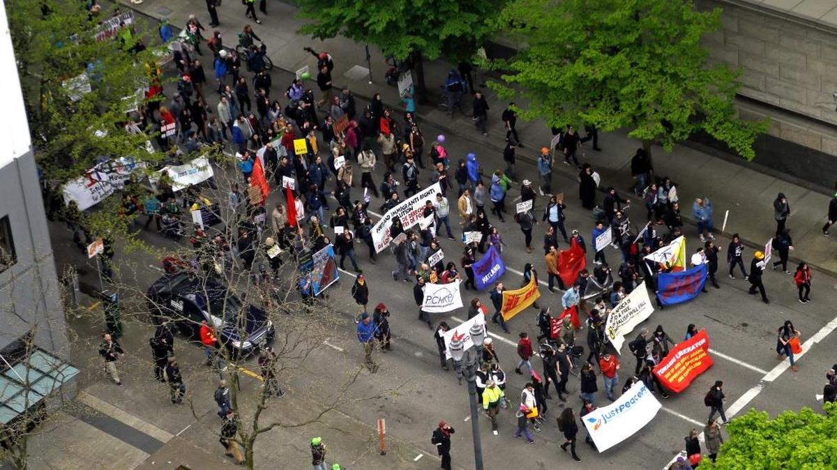 People march in Portland on May 1 to protest against President Donald Trump’s efforts to boost deportations.
