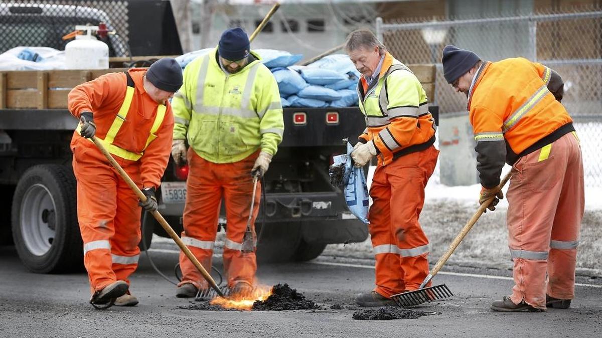 A crew of workers from the City of Kennewick use a propane torch and a cold patch material to temporarily repair a couple potholes Tuesday afternoon on South Union Street near West Fifth Avenue. The workers have been busy recently repairing the damaged roadways being created by recent wet, snowy and icy winter weather conditions. From left, they are: Brennan Lounsbury, Bobby Flores, Rod Pitts and Kevin Reiland. Patchy freezing fog is forecast for mornings through the weekend. A slight chance of light snow was forecast for Tuesday night through 10 a.m. Wednesday morning