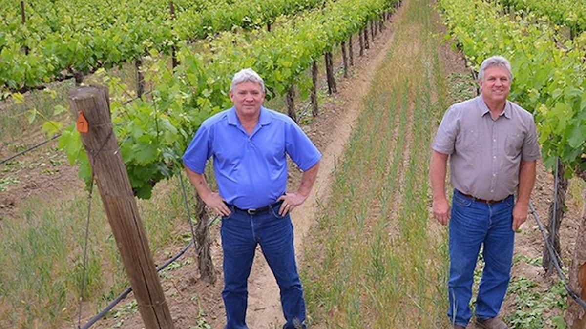 Brothers Bob Gamache, left and Roger Gamache recently completed the sale of their Gamache Vitners building and land in the Prosser wine village.