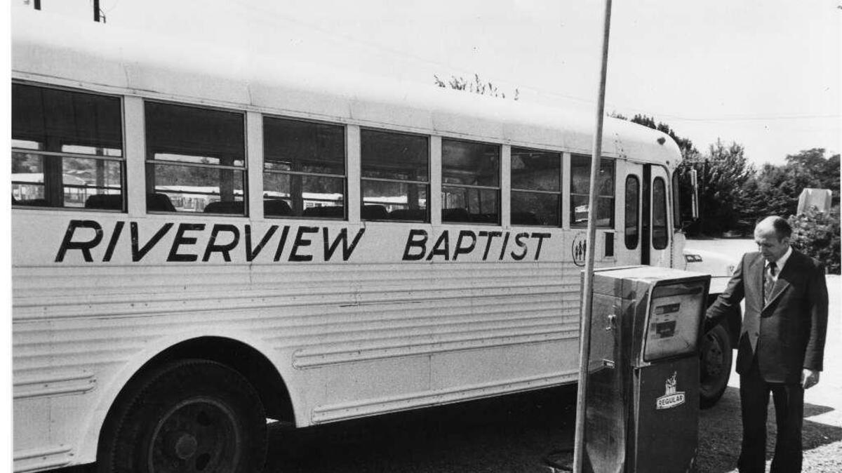 Rev. John Paisley of the Pasco Riverview Baptist Church checks the gas pump for his fleet of school buses, in this photo published in August 1980. Gas prices had risen from 68 cents in 1978 to $1.19 in 1980. The 25-bus fleet covered 300 miles of bus routes each week.