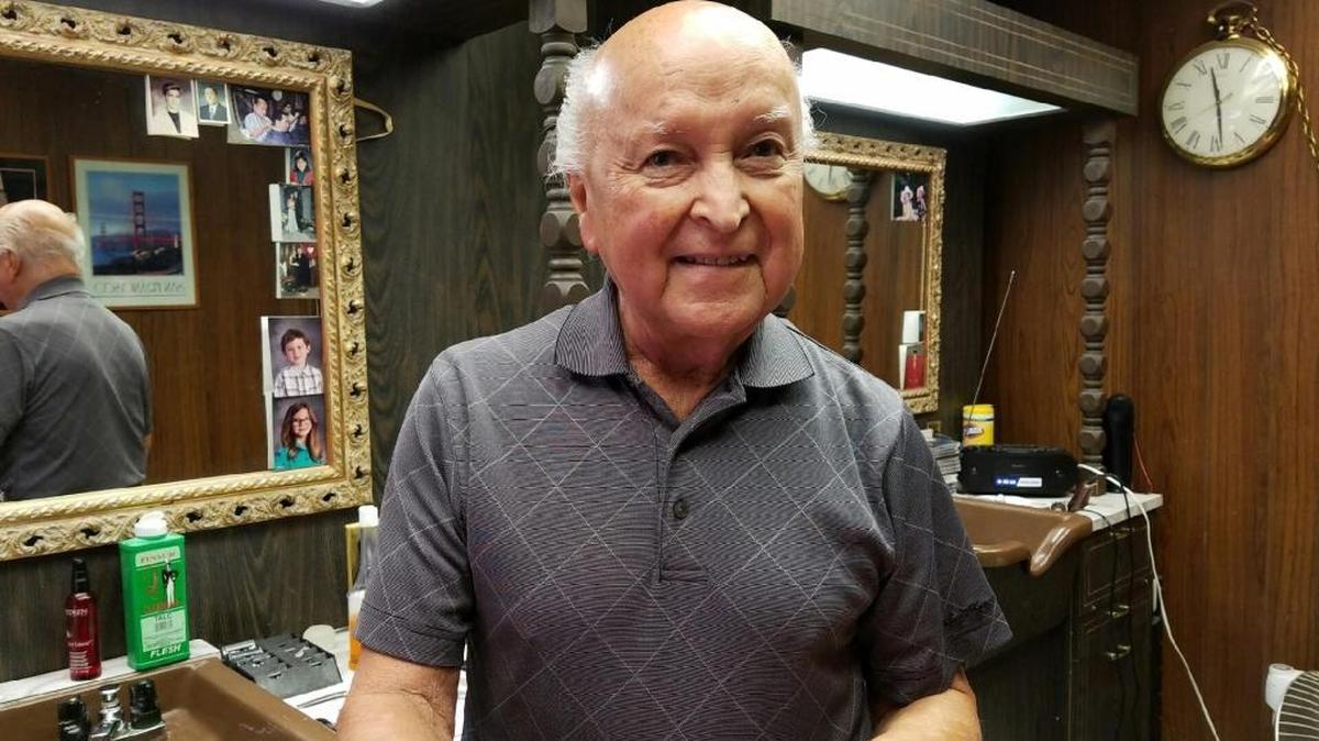 Larry Maltos worked as a barber in downtown Kennewick for 64 years until he broke his neck. After a six-month recovery, he has returned to the shop.