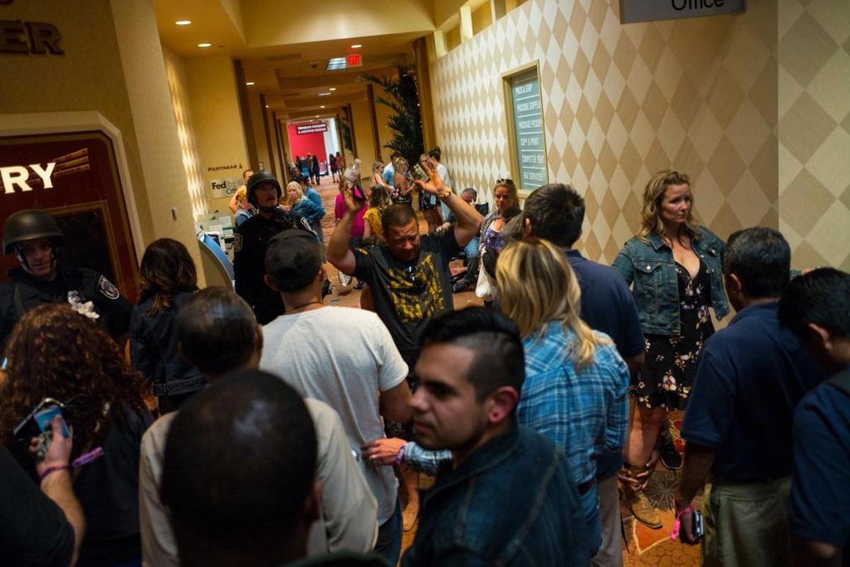 People are searched by Las Vegas police at the Tropicana Las Vegas during the shooting on the Las Vegas Strip on Oct. 1.