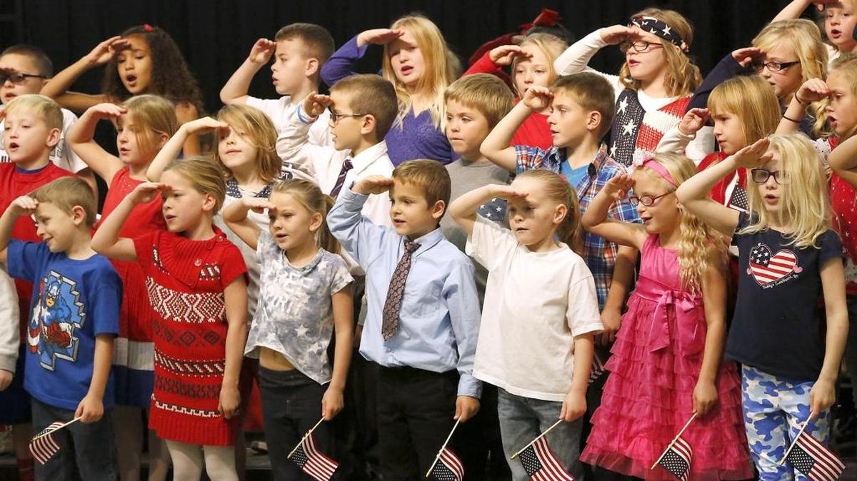 Second-grade students at Cascade Elementary School perform a singing tribute during their first of two Veterans Day assemblies Tuesday at the Kennewick school. Music teacher Teddi Bay organized the annual event attended by all the students and members of their families. Many other schools around the Mid-Columbia also organized a variety of events to recognize Veterans Day.