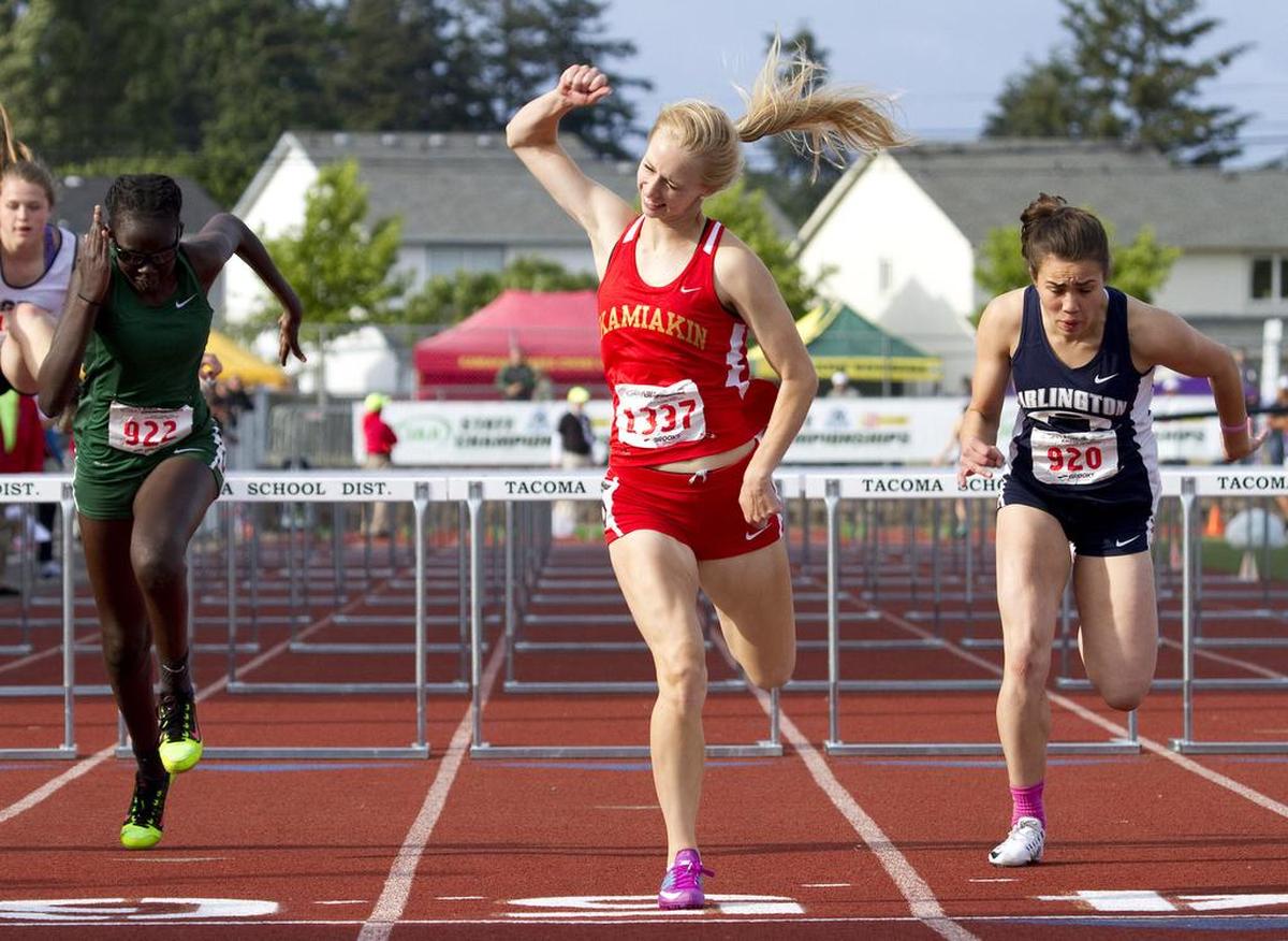 May 28, 2016 - Kamiakin’s Heather Donais celebrates as she crosses the finish line in first place in the Class 3A girls 100-meter hurdles Friday at the state track and field championships in Tacoma.