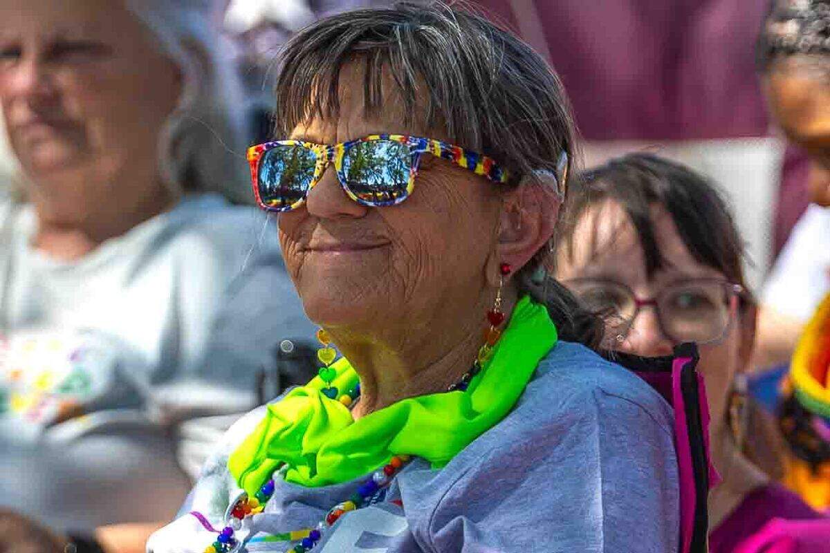 A festival attendee watches the stage performances during a drag performance at the Tri-Cities Pride Festival.