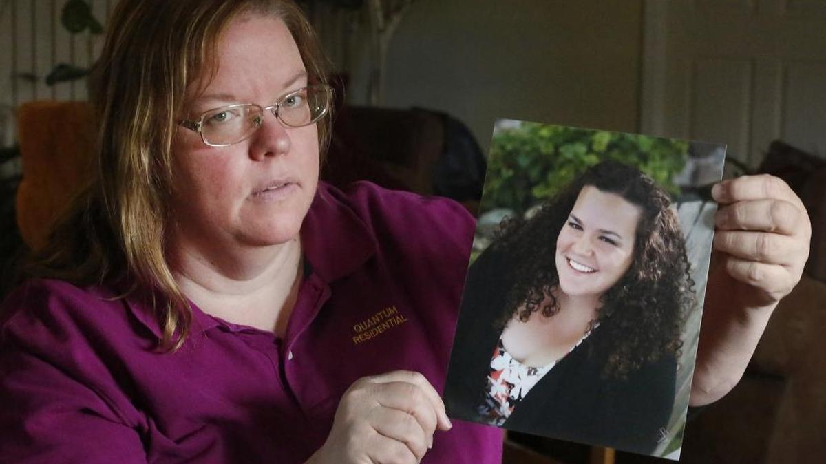 Jackie Harvey holds a portrait of her daughter, Pamela, 23, that was taken in May before she left for her post in Uganda as a Peace Corps volunteer. The 2010 Kamiakin High graduate was stabbed Sept. 28 while sleeping. She has gone through three major surgeries and her parents are hopeful she soon can return home. Watch a video at: www.tricityherald.com/video.