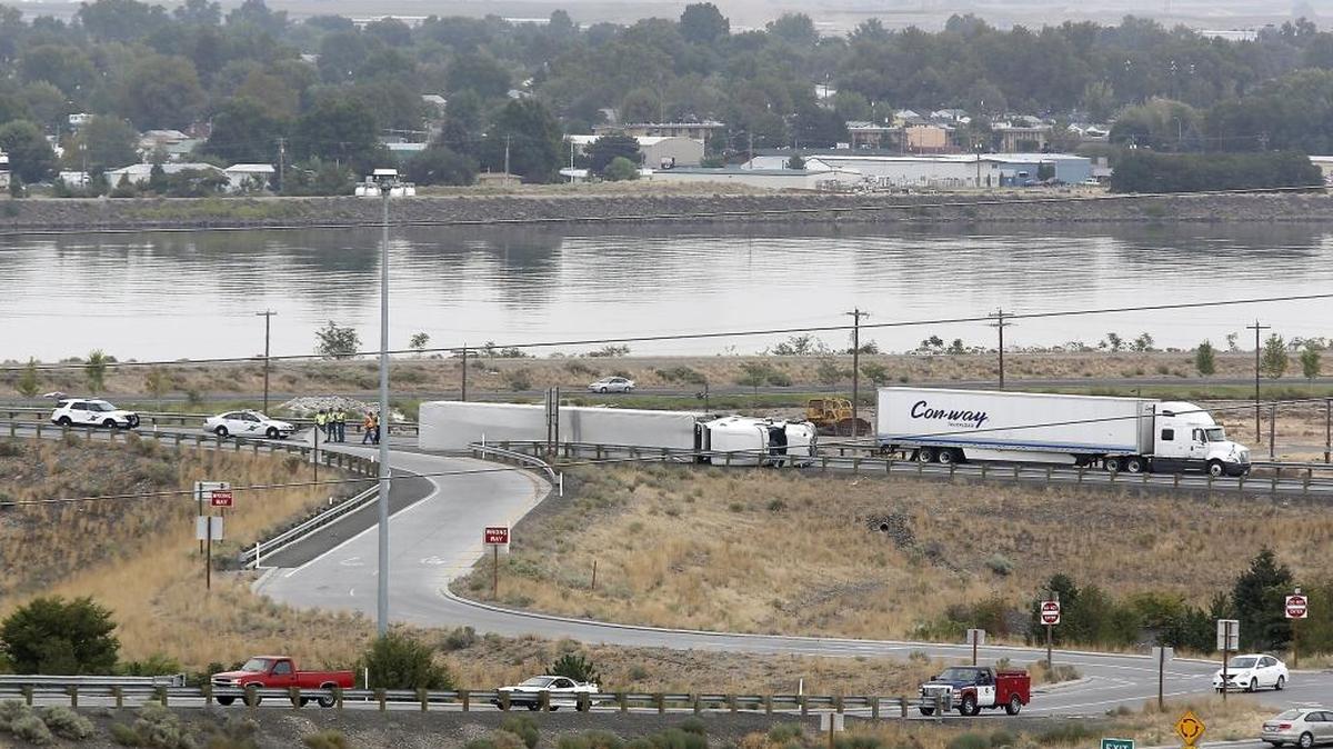 An overturned semi-truck and trailer partially blocked the southbound lanes of Highway 395 near the blue bridge on Tuesday afternoon. The semi rolled over about 1:15 p.m. just after crossing the bridge, blocking the off ramp to West Columbia Drive, said the state Department of Transportation. The wreck tied up traffic in the area while crews worked to remove the truck and trailer. No injuries were reported.