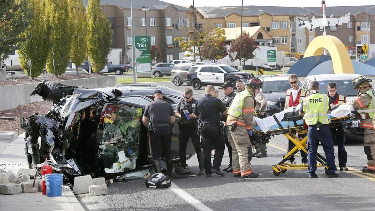 
Kennewick firefighters and paramedics prepare to take Sherry Kay Lorang, 64, to the hospital Wednesday after she drove into a concrete block retaining wall and rolled her late-model Nissan Rogue in front of 7104 W. Grandridge Blvd. in Kennewick. Kennewick police officials say the single-car collision is under investigation. Fire officials described her condition as stable with minor injuries.
