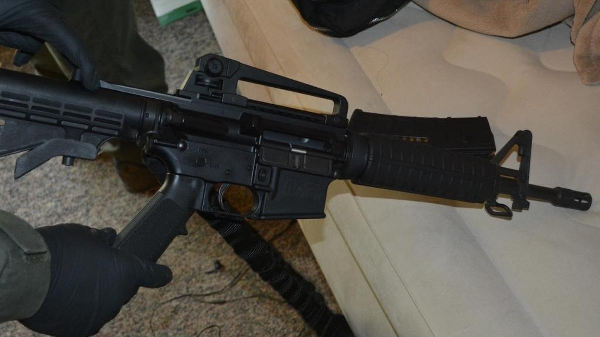 Authorities show one of the many guns seized during two months of busting a large series of pot grow operations across Franklin, Grant and Adams counties. The rifle is a Smith & Wesson-made AR-15-style rifle.