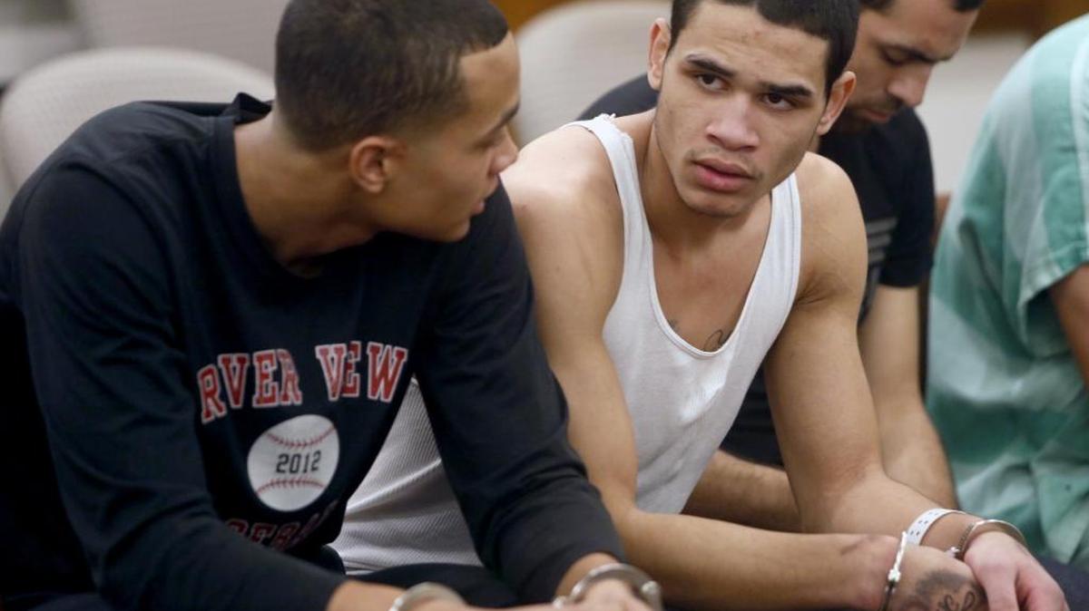 Michael D. Anderson III, left, has been charged with helping his younger brother, DeShawn I. Anderson, right, evade capture for nearly a month during a violent Pasco crime spree in late 2014. DeShawn Anderson, pictured in Franklin County Superior Court after their initial arrests, is serving almost 94 years for murder and multiple assaults.