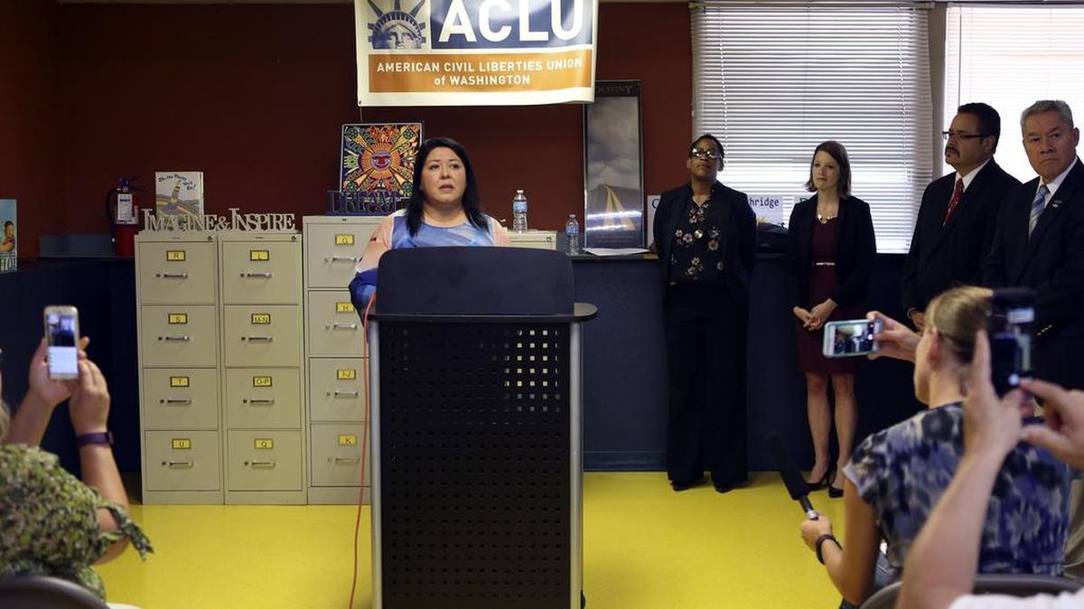 Audience members take photos with their phones as Bertha Aranda Glatt speaks Thursday during a press conference announcing the ACLU has filed a lawsuit against the City of Pasco. Glatt, who challenged Mayor Matt Watkins for a seat on the City Council in 2015, is the plaintiff on the ACLU case that states the City's at-large election system violates the federal Voting Rights Act.