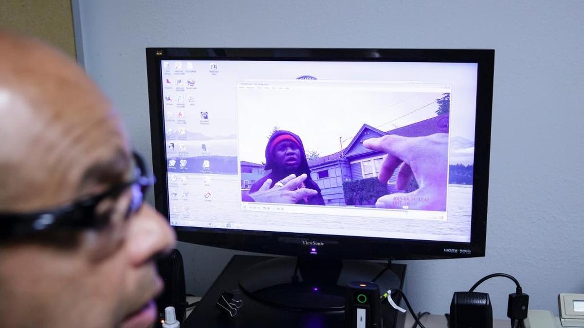 
Officer Daniel Enriquez views footage taken with a body camera during his patrol in Seattle, April 24, 2015. While some departments cite privacy concerns or the administrative burden of making the videos available to the public, the Seattle police post everything. 
