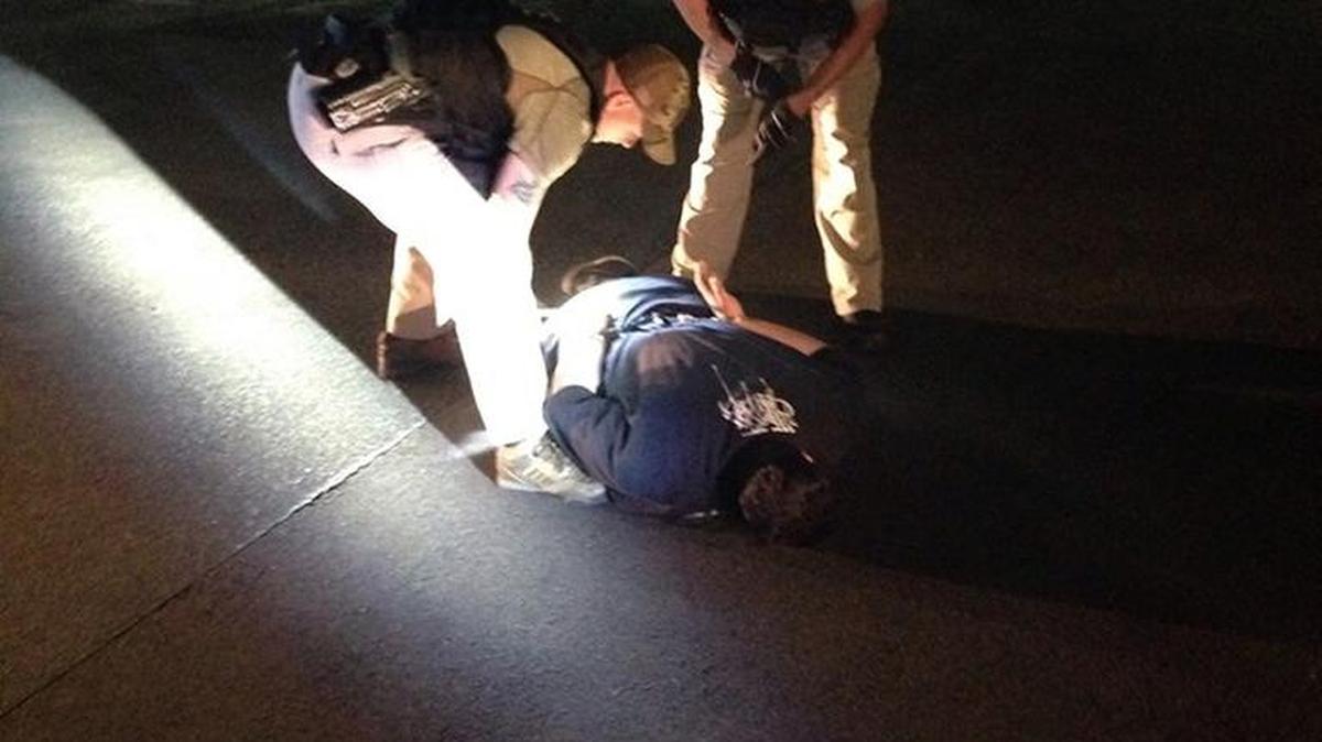 Kennewick police took down an accused shoplifter behind Rite-Aid in Kennewick Friday night.
