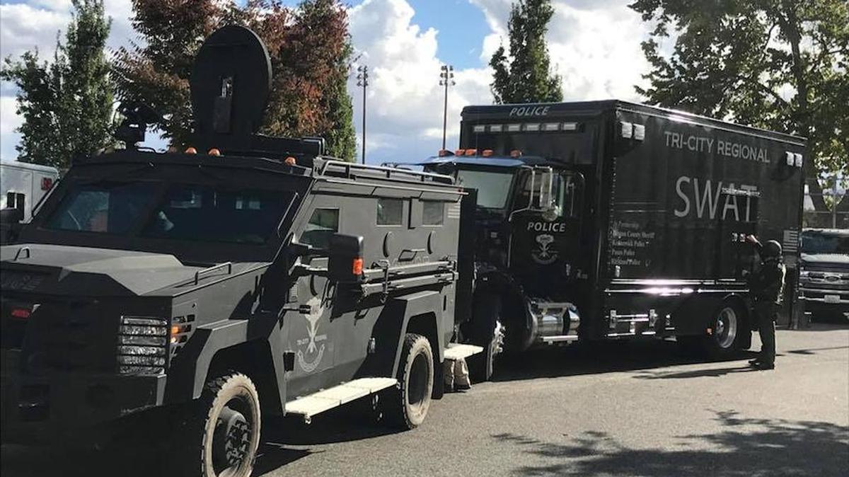 Kennewick police shut down 27th Avenue at Fruitland Street on Fridya afternoon so that the Tri-City Regional SWAT ream could search and arrest a Pasco shooting suspect, Anthony Martinez Mata.