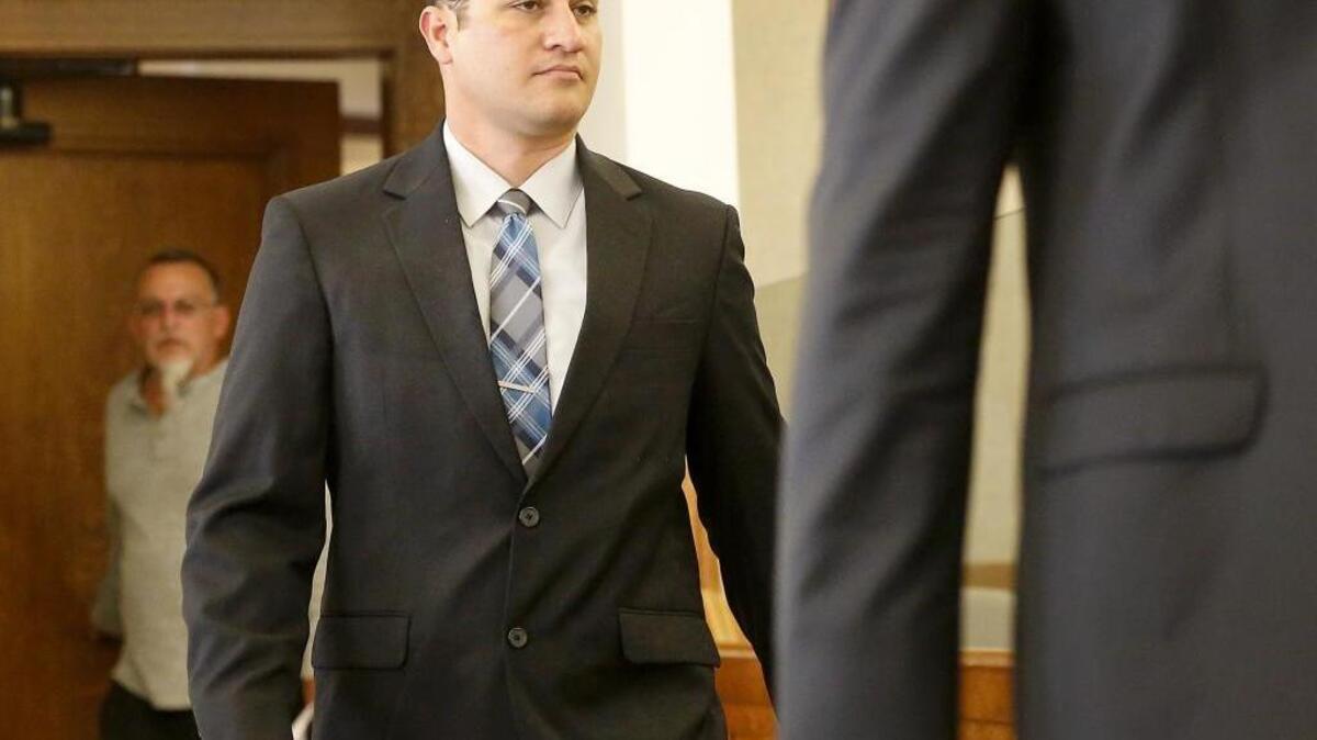 Anthony James Haworth, 38, appears Tuesday morning in Franklin County Superior Court. The Pasco police officer is facing four felony charges for sex crimes and his arraignment was postponed one week.