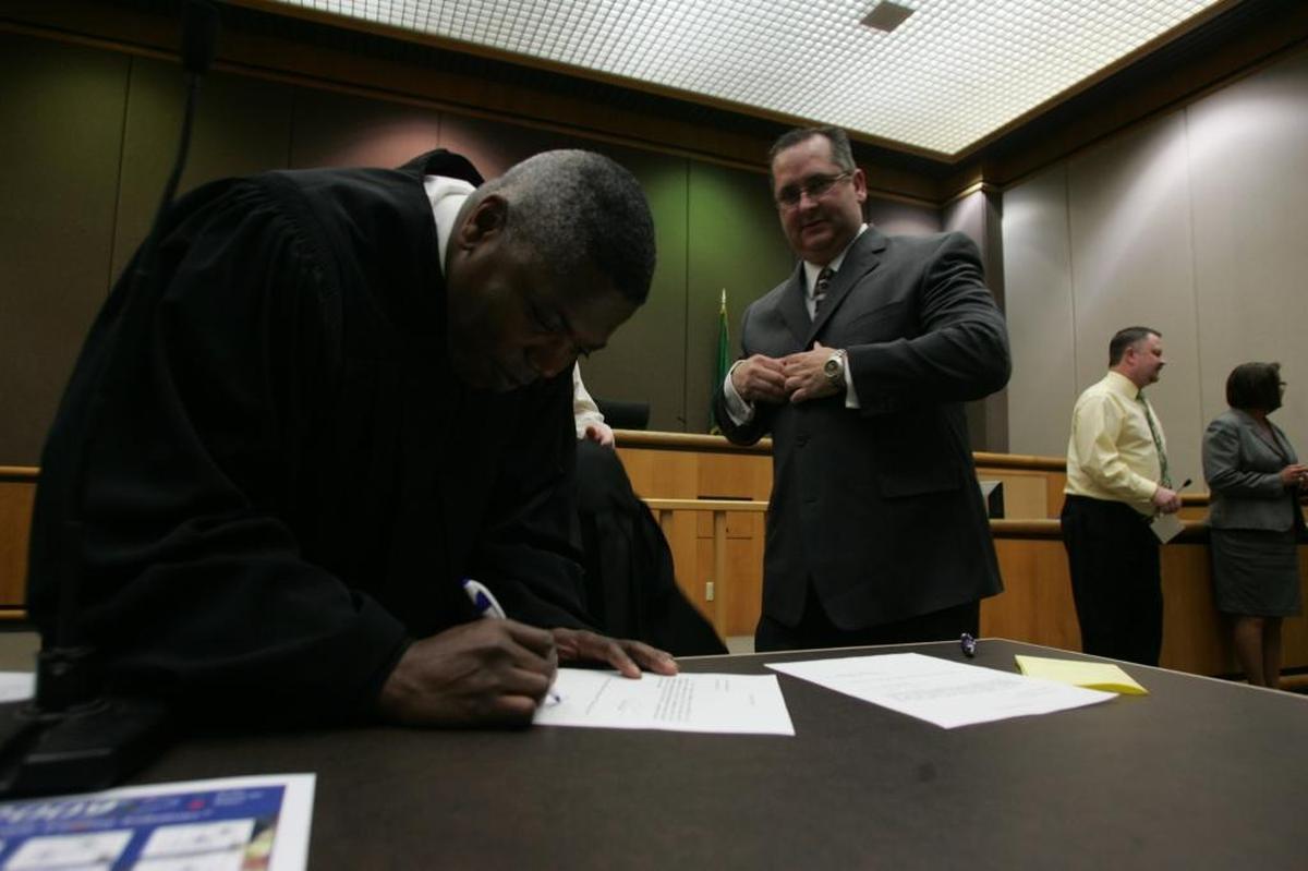 Judge Terry M. Tanner, right, was sworn in to Benton County District Court in 2009 by Superior Court Judge Cameron Mitchell. Tanner, a former Richland city councilman, was appointed to the bench after Judge Eugene F. Pratt retired.