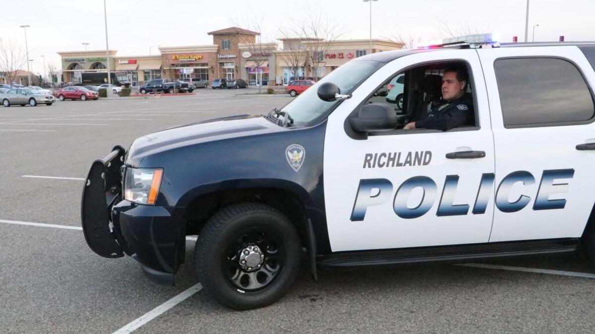 Richland police Officer John McCauley patrols one of the shopping areas in Richland.