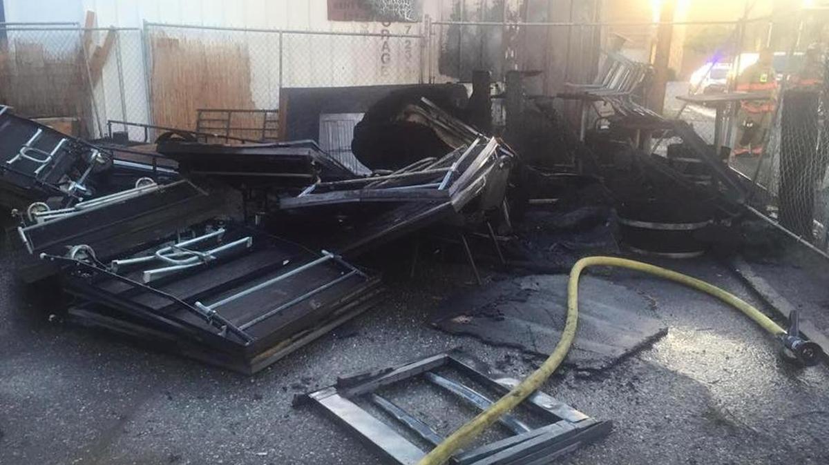 The fire started about 5:30 a.m. at 109 W. Kennewick Ave. before Kennewick police and fire responded, police said. Several tables and chairs were destroyed in a fenced-off area and a building was threatened.