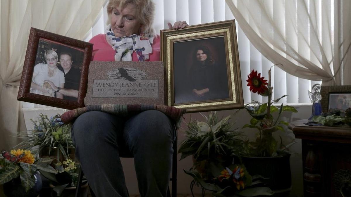 Marcia Pack of West Richland holds photos of her daughter Wendy Kyle, who was killed in California in 2001. No arrest was ever made in her case, but it’s still under investigation and two men are considered people of interest in the murder.