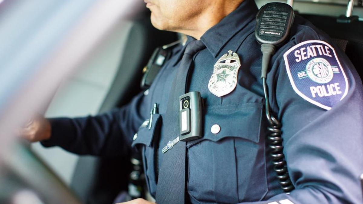 
Officer Daniel Enriquez, equipped with a body camera, on patrol in Seattle. While some departments cite privacy concerns or the administrative burden of making the videos available to the public, the Seattle police post everything.
