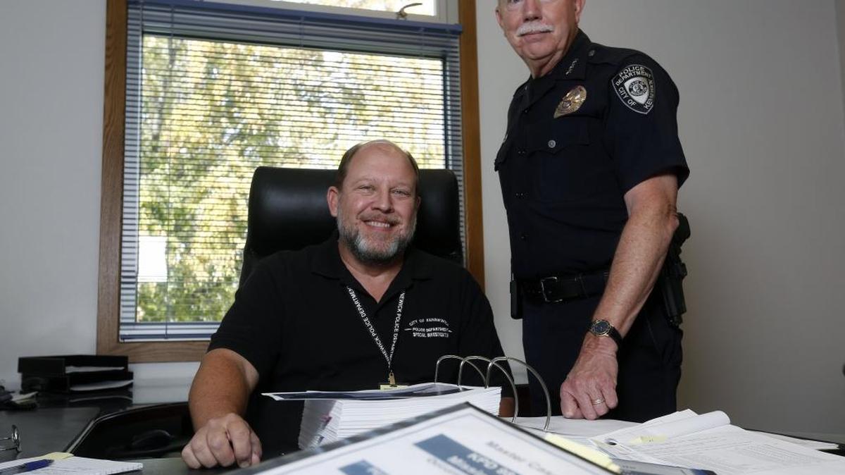 
Former Richland police Captain Al Wehner, left, and Kennewick Police Chief Ken Hohenberg look over cold cases Thursday.

