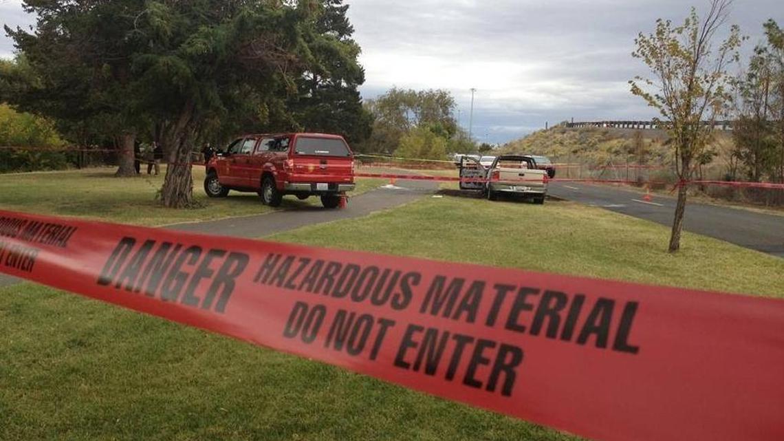 Crews from Kennewick fire and Kennewick police investigate a truck fire reported about 2 p.m. Friday. Crews found the body of a man inside after putting out the flames.