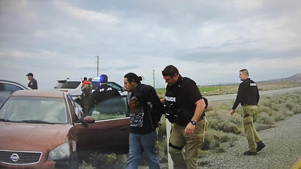 Pasco police take Richard Vasquez into custody Wednesday after a chase across the Tri-Cities.