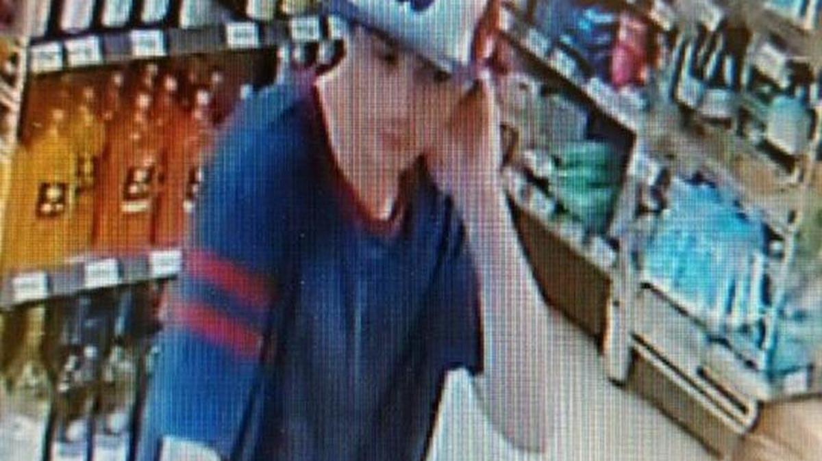 The male in the photo is using a credit card stolen from a parked vehicle. Kennewick police are asking the public for help in identifying him.