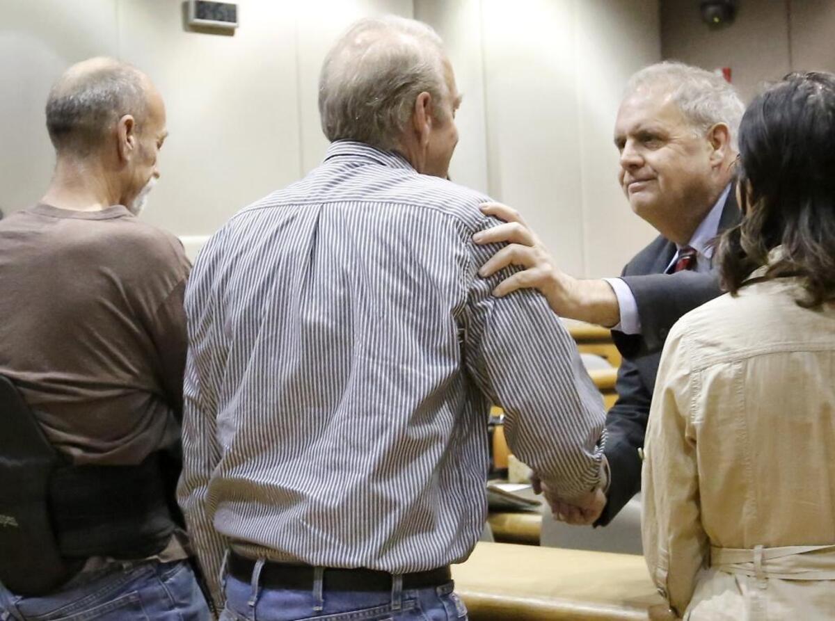 Benton County Prosecutor Andy Miller shakes hands with Randy Harris on Monday after Theresa L. Wiltse pleaded guilty to aggravated murder and kidnapping charges involving the Nov. 18, 2016, disappearance and death of Harris' wife, Sandra. Watch a video at tricityherald.com/video