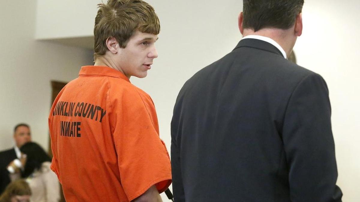 Caleb R. Crenshaw, 20, appears with defense attorney Joshua Lilly on Tuesday in Franklin County Superior Court on charges of criminal mistreatment and assault of a child. His trial was postponed for three months.