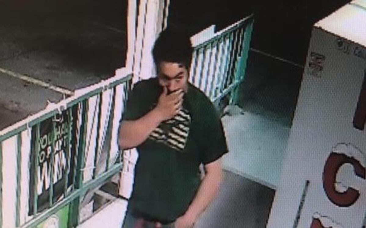 A video surveillance camera captured this photo of a person police would like to talk to in connection with a break in at the Super Mini Mart in Kennewick.