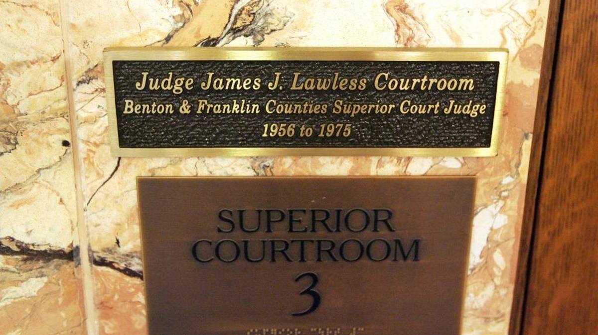 A sign in the rotunda of the Franklin County Courthouse in Pasco pays tribute to the late Judge James Lawless.