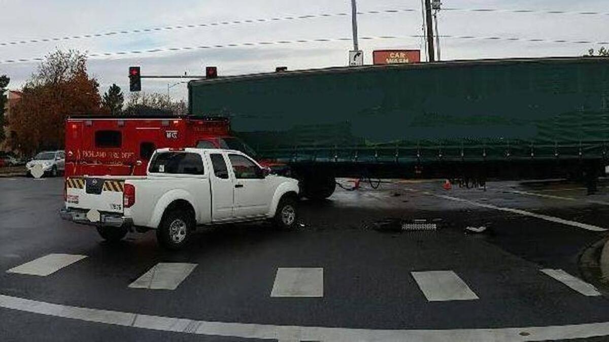 Kennewick police took this photo of a semitruck-vs-pickup crash at Columbia Center Boulevard and Deschutes Avenue on Thursday.