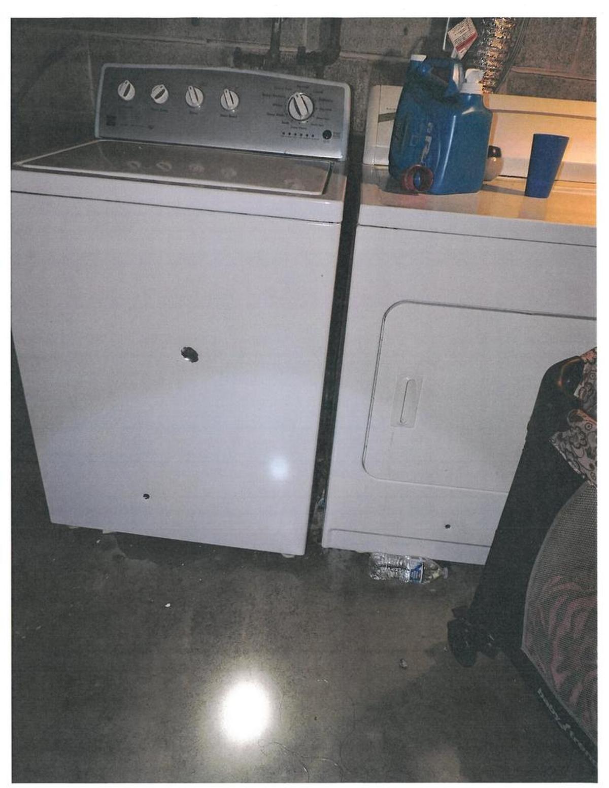 Three Pasco officers stood in front of the washer and dryer during the exchange of gunfire with Edwin Espejo. At least three bullets went into the basement appliances.