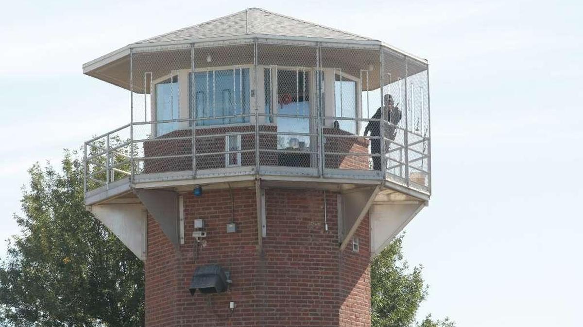 A corrections officer at the Washington State Penitentiary in Walla Walla is being held in the Pierce County jail.